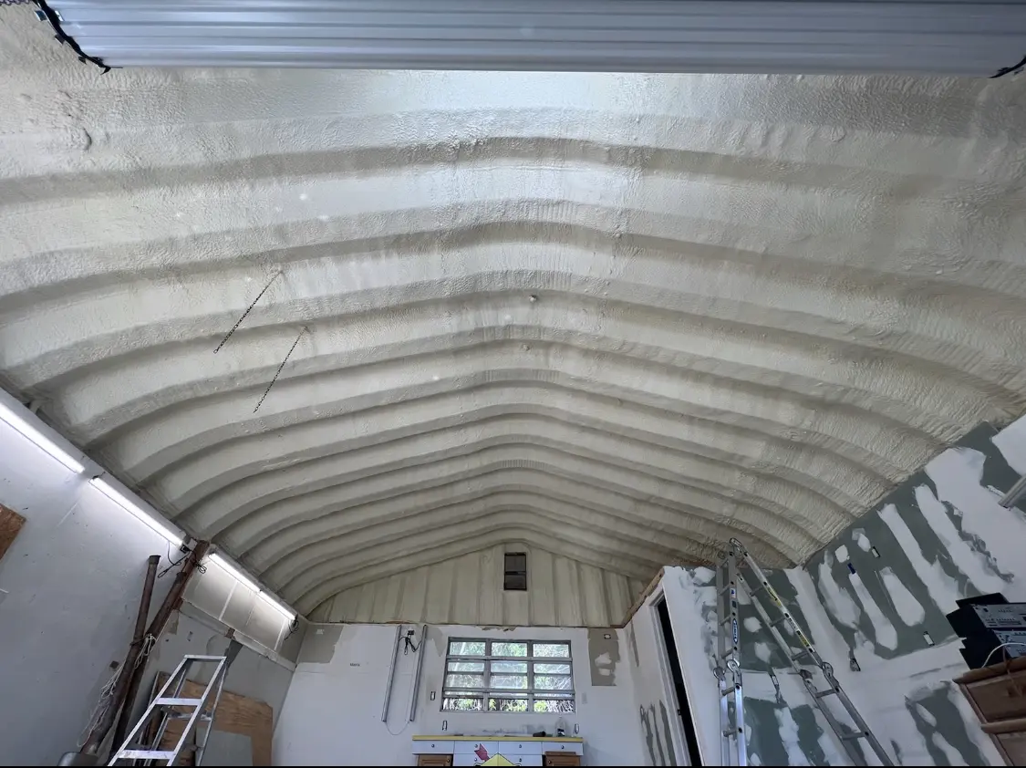 Spray polyurethane foam applied to the underside of a metal roof deck in Appleton
